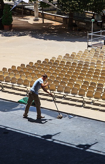 man cleaning a stage